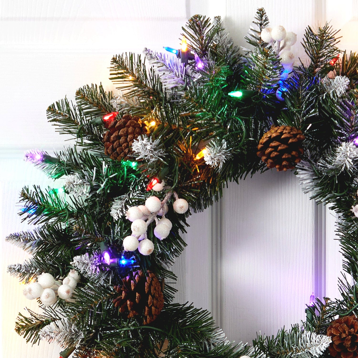 24” Snow Tipped Artificial Christmas Wreath with 50 Multicolored LED Lights, White Berries and Pine Cones